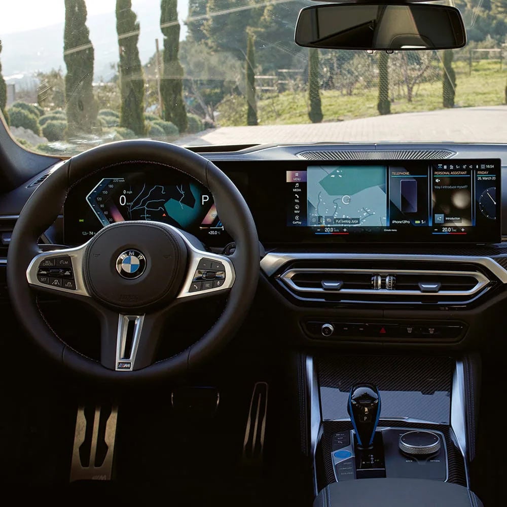 A driver's eye view of steering wheel and controls of the BMW i4 | Bachrodt BMW in Rockford IL