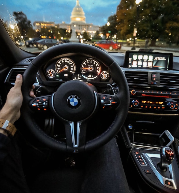 Interior of a new BMW with the United States Capital Building in the background seen clearly through the windshield.