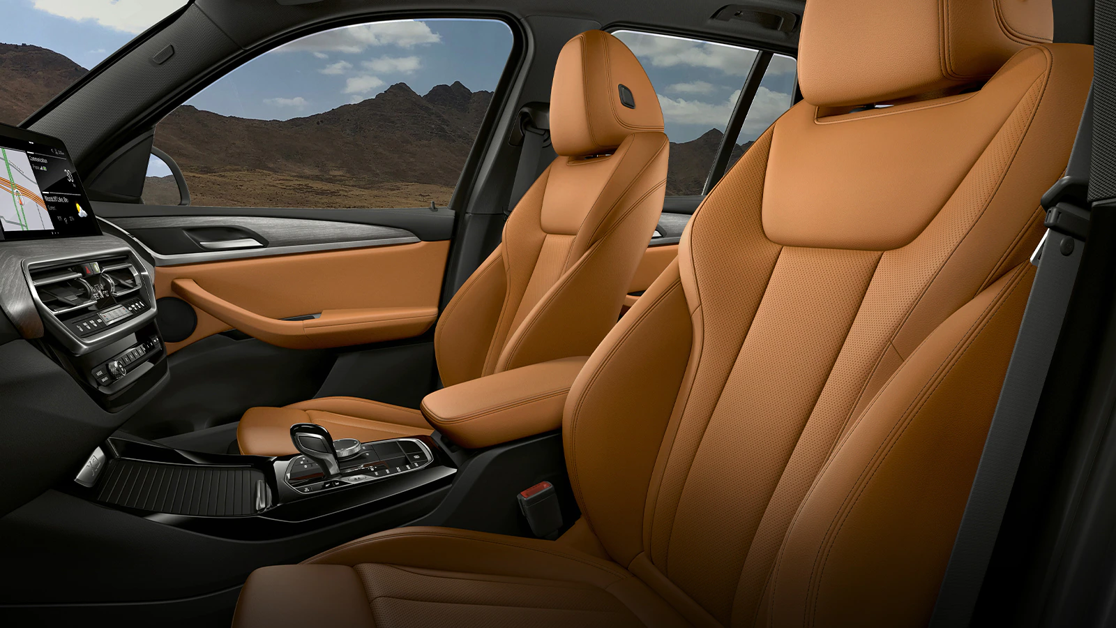 An interior view of the 2023 BMW X3 front seats