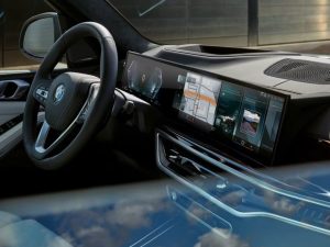 The interior of the 2023 BMW X5 curved display through a side window