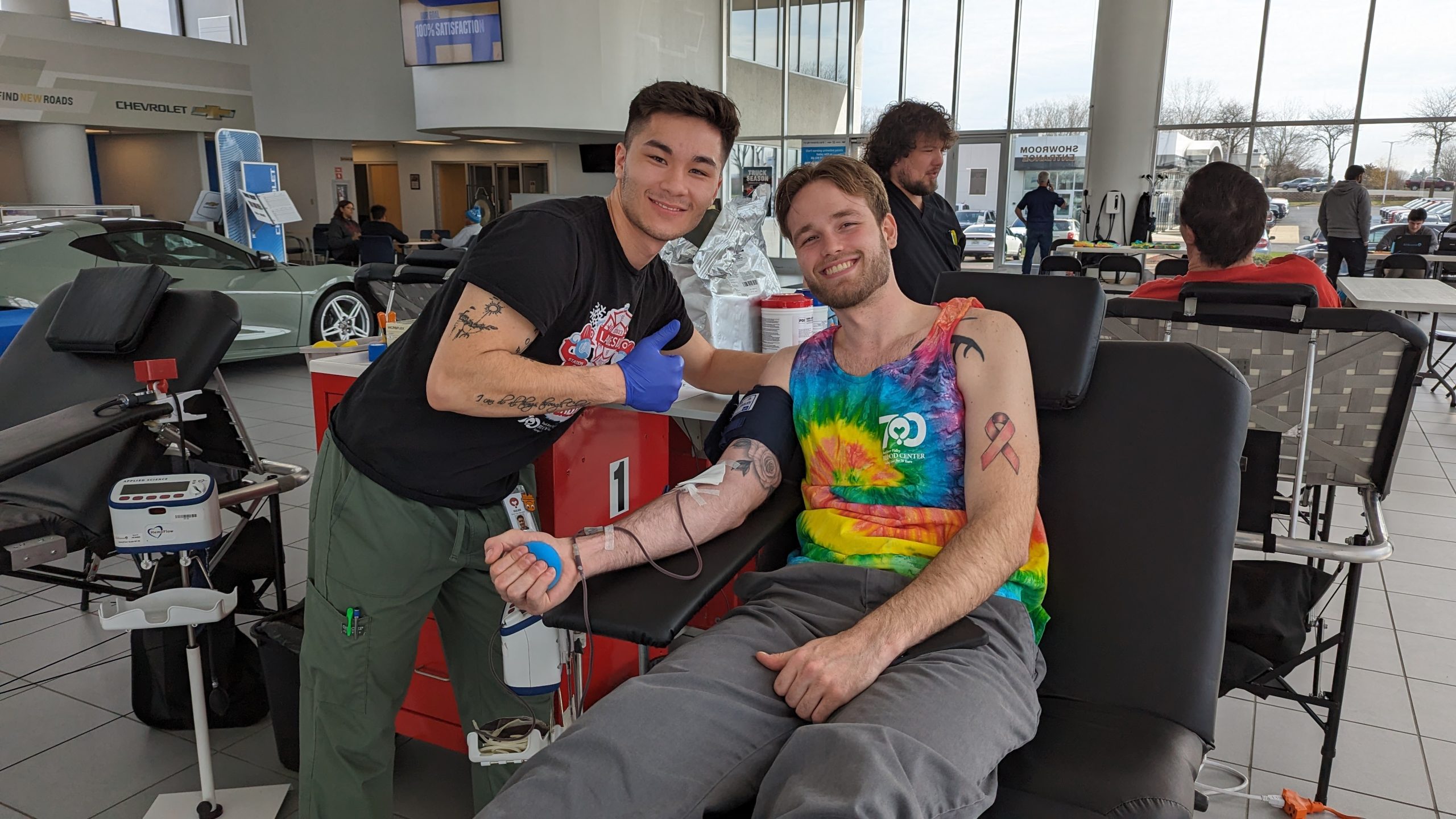 person donating blood at lou bachrodt bmw's blood drive