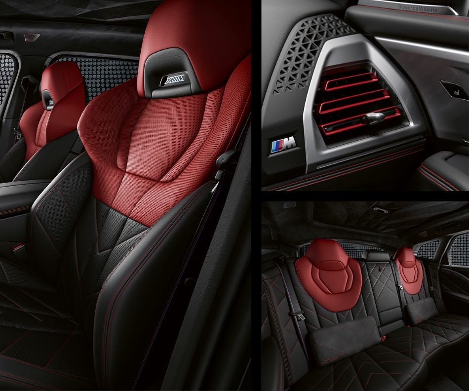 Detail of front seats, clad in exclusive BMW Individual Fiona Red & Black Merino Leather with exclusive M Signature Trim and red stitching and accents. Detail of red accented vent. Detail of rear M Lounge with exclusive XM pillows in Bachrodt BMW | Rockford IL