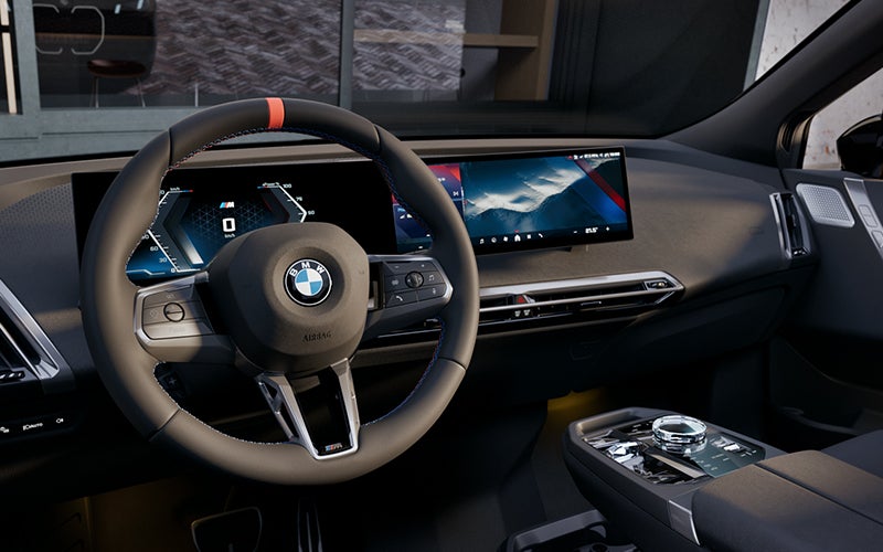 Interior steering wheel and dashboard of the BMW iX M70. | Bachrodt BMW in Rockford IL