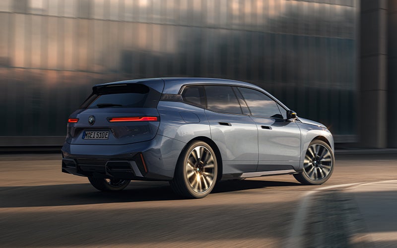 The BMW iX driving with the front wheel turned. | Bachrodt BMW in Rockford IL